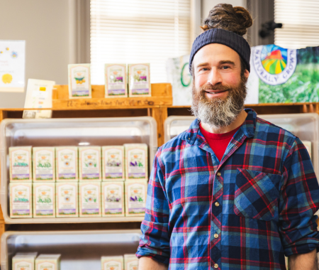 A green wagon full of fresh vegetables